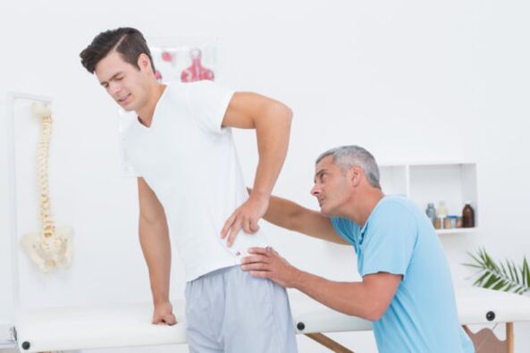 Examination by a doctor for lower back pain