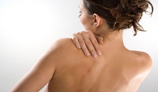 The woman is worried about the pain under the left shoulder blade in the back from behind