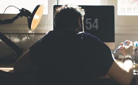 A man on a computer